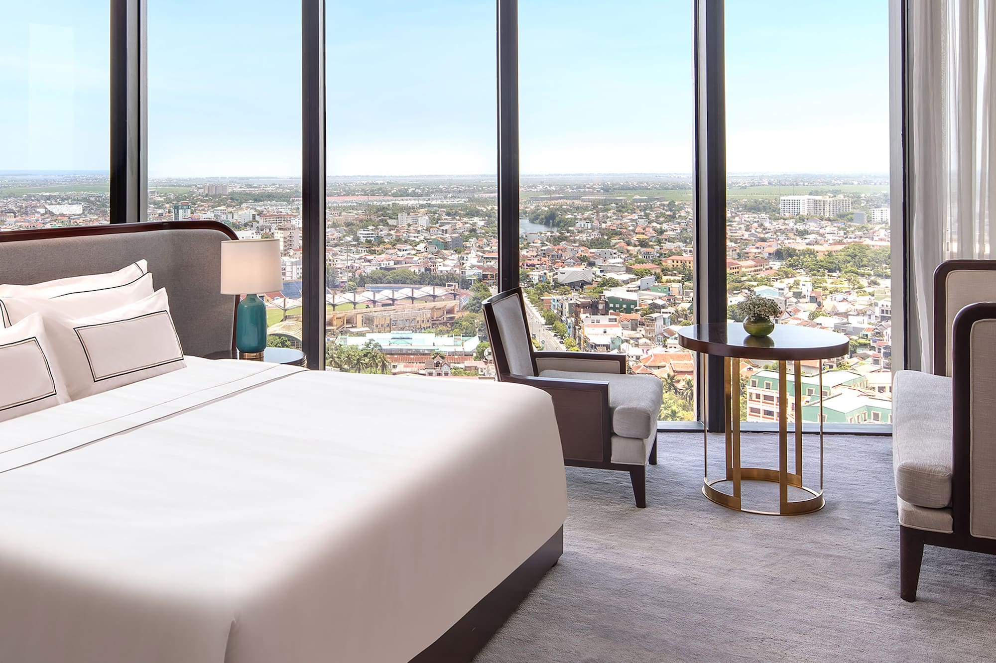 a room with a large window overlooking a city