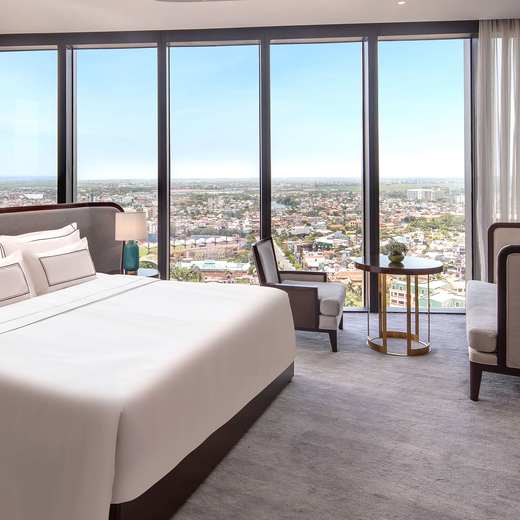 a room with a large window overlooking a city