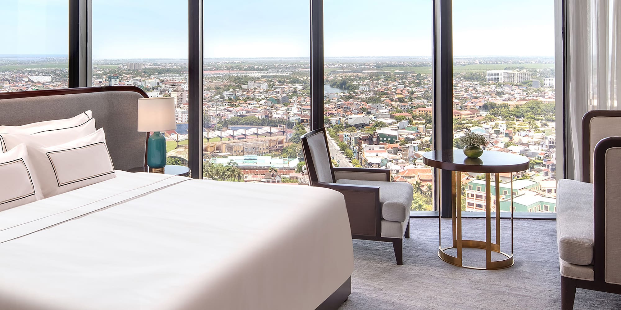 a room with a large window overlooking a city