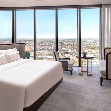 a room with a large window overlooking a city