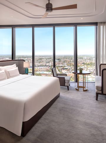 a room with a large window overlooking a city