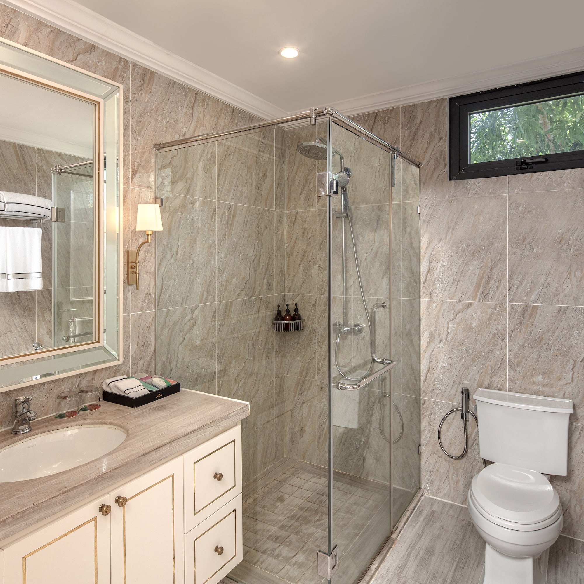 a bathroom with a glass shower and sink