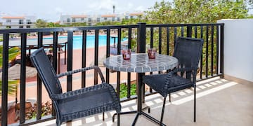 a table and chairs on a balcony