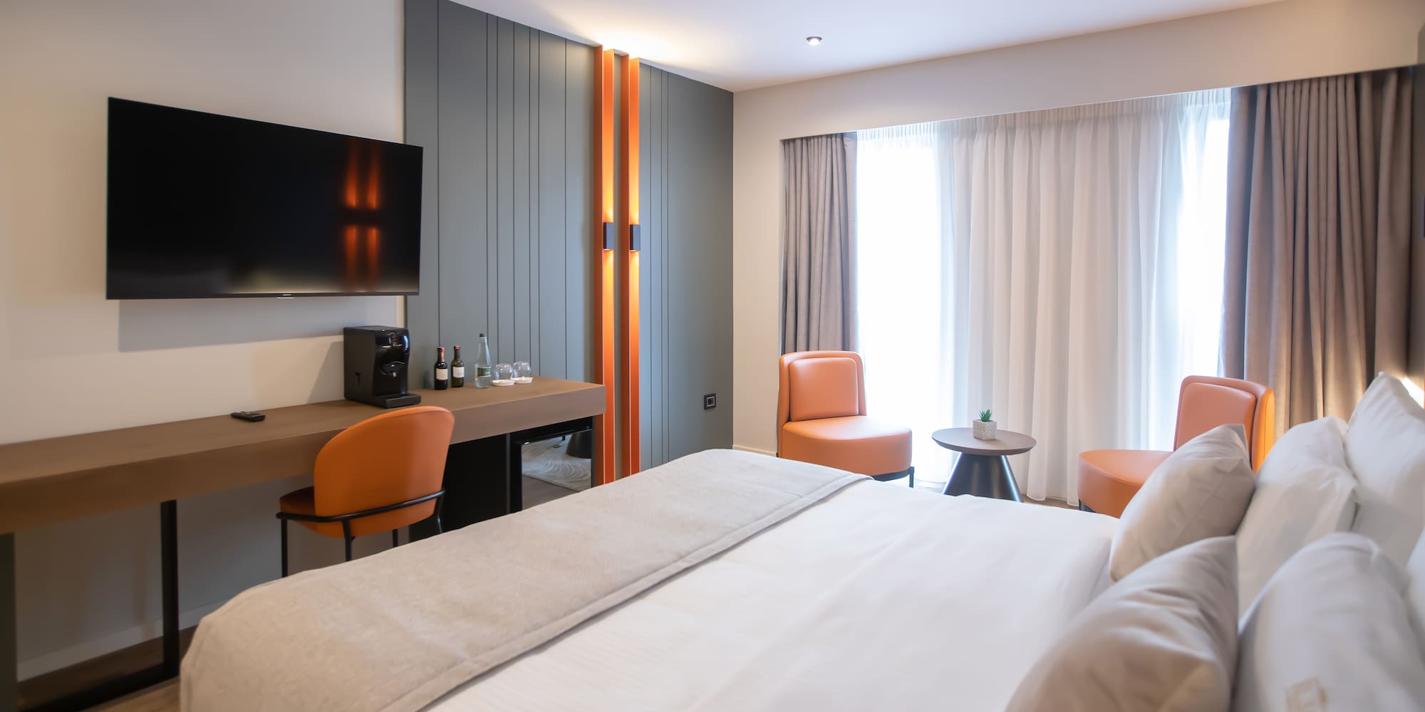 a room with a bed and a tv