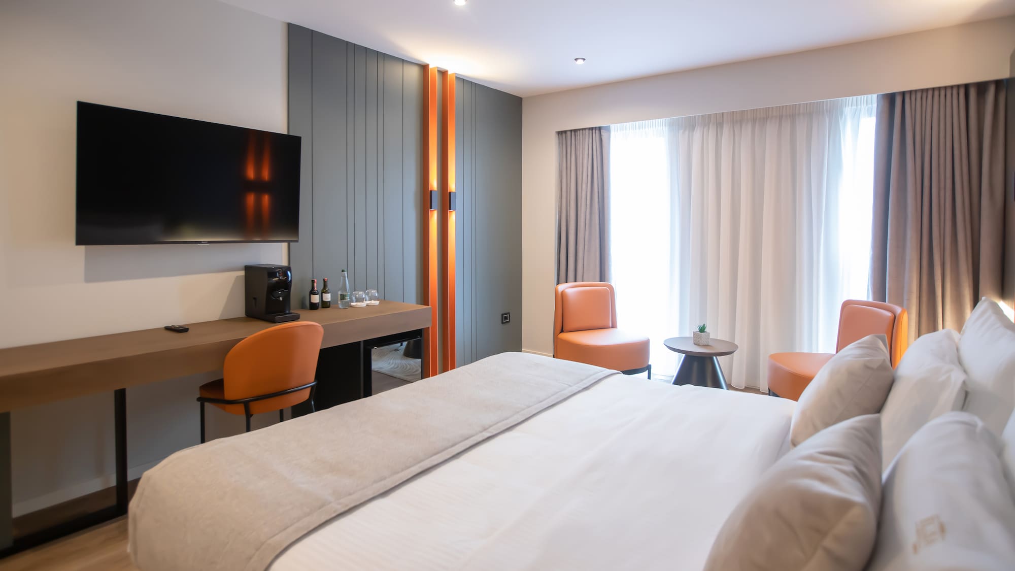 a room with a bed and a tv