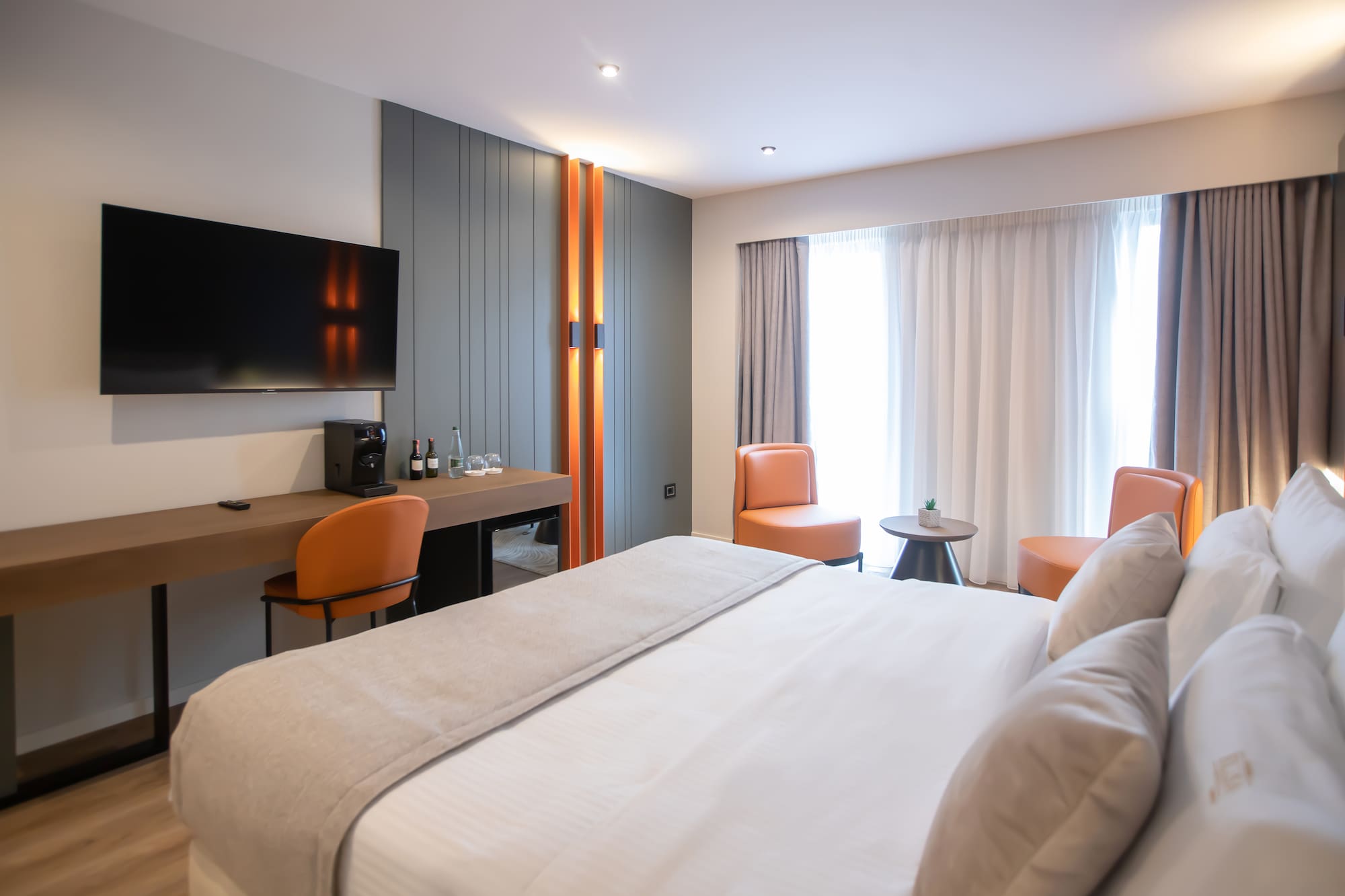 a room with a bed and a tv