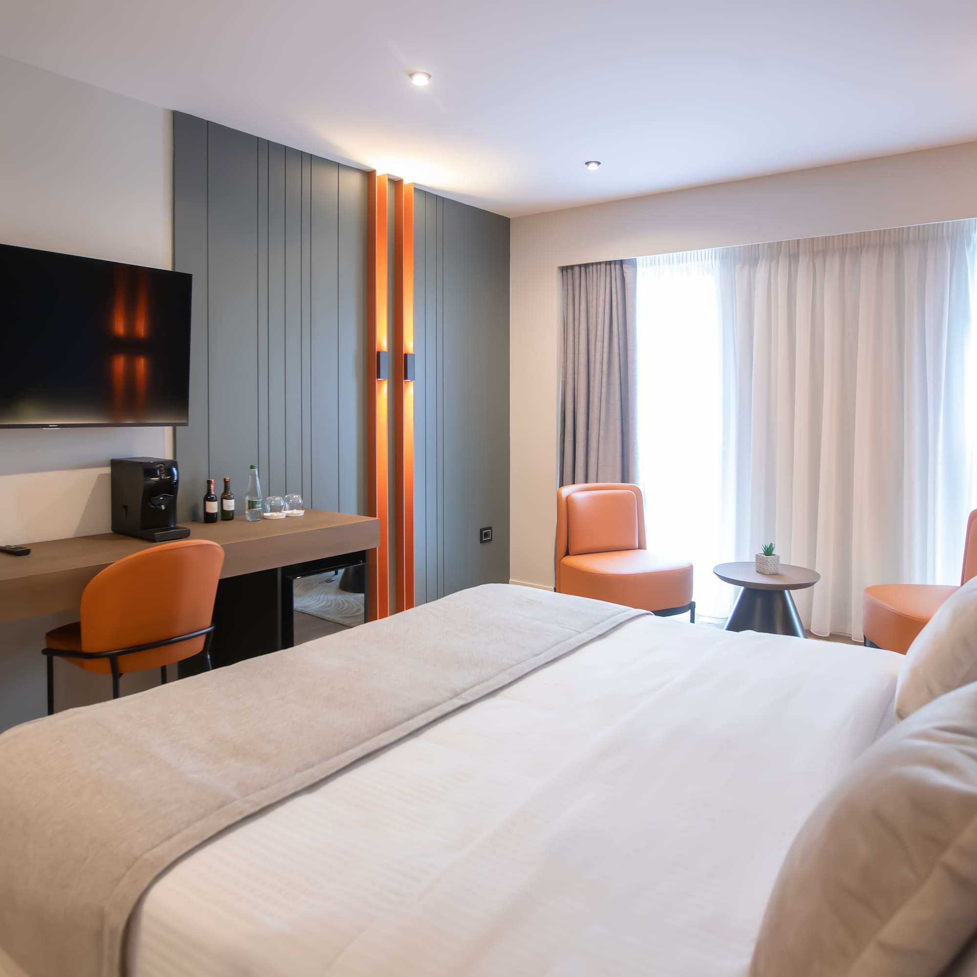 a room with a bed and a tv