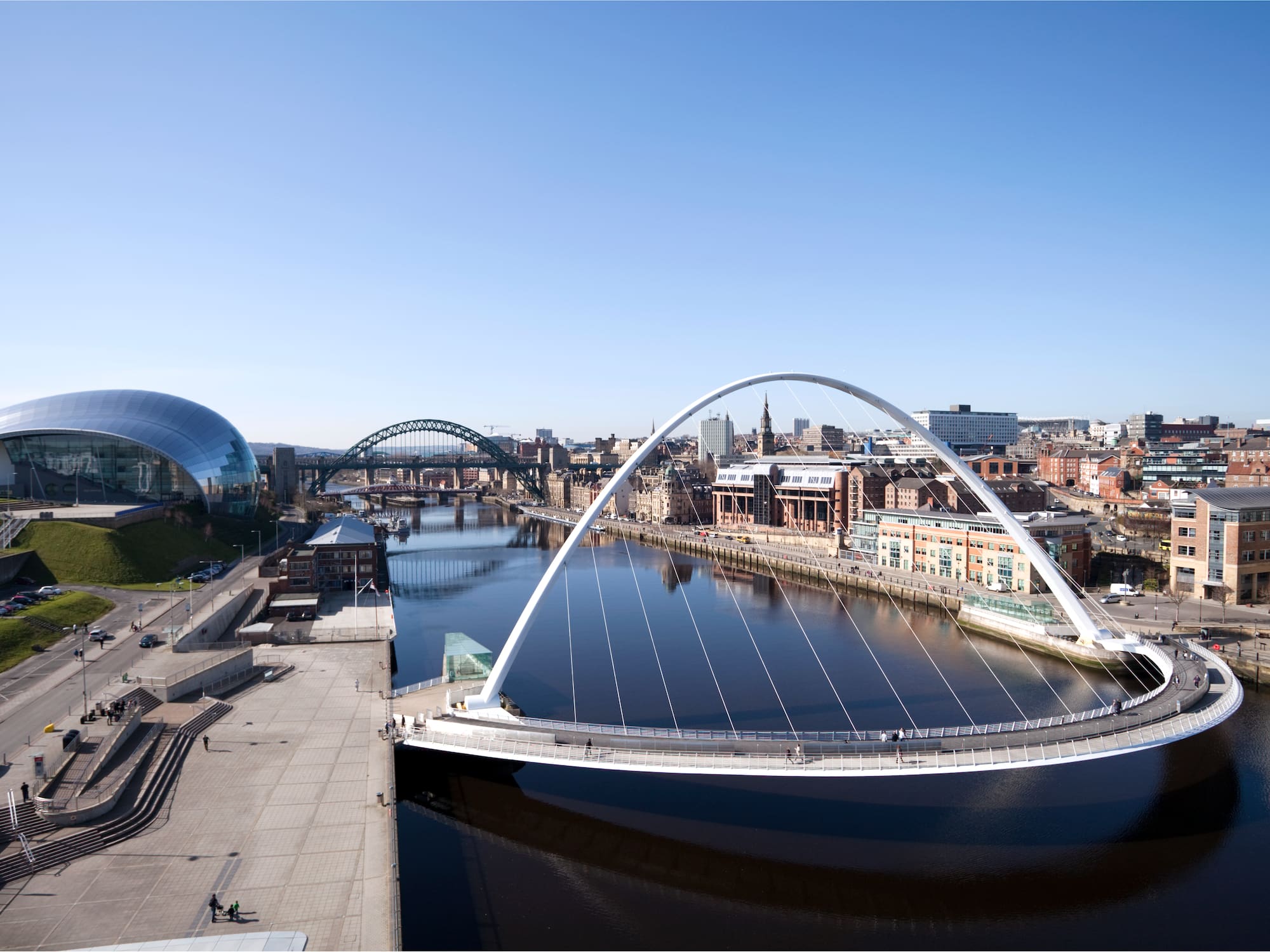 Gateshead Millennium Bridge, River Tyne cityscape with Sage Gateshead and Tyne Bridge.