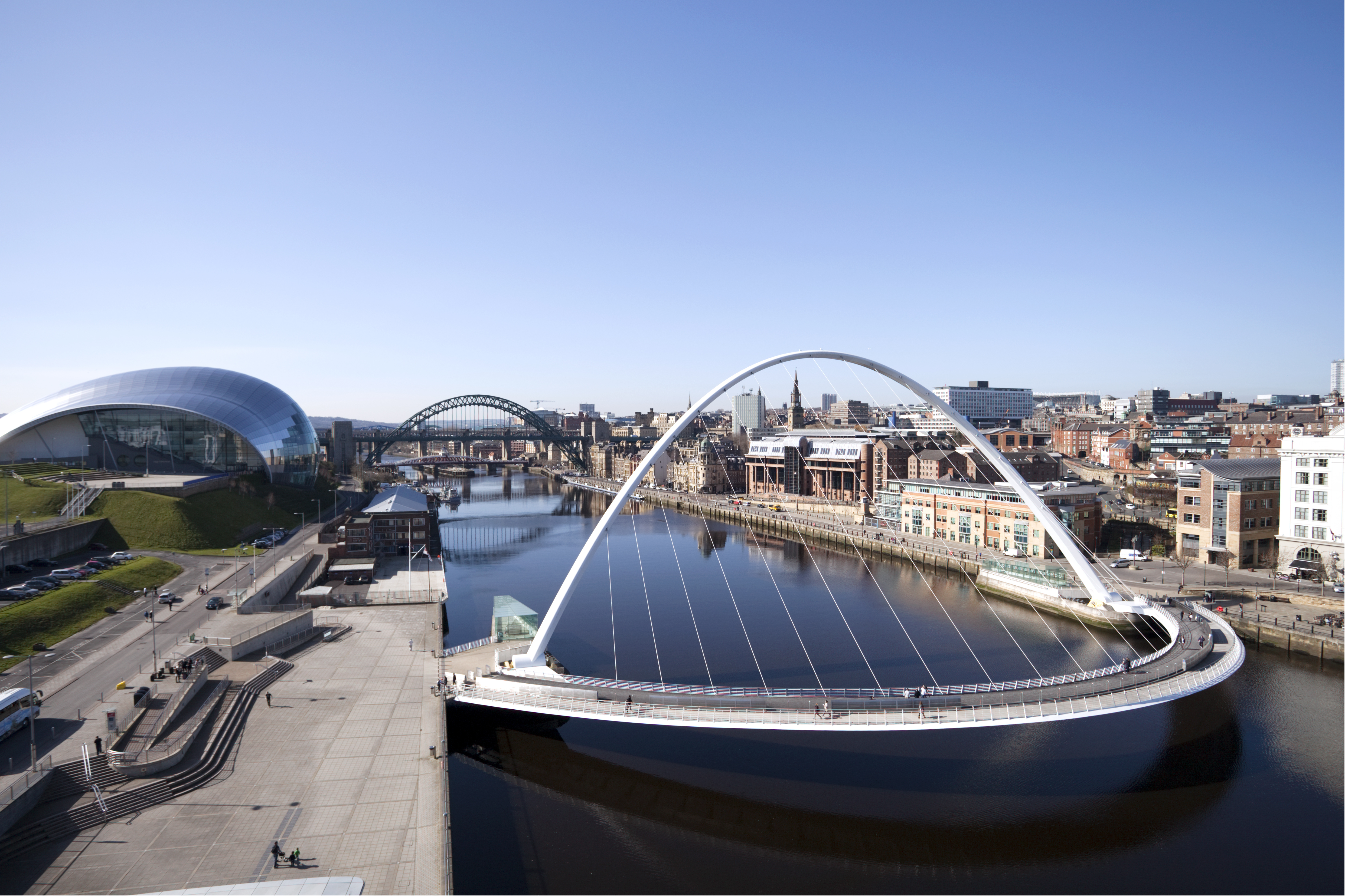 Gateshead Millennium Bridge, River Tyne cityscape with Sage Gateshead and Tyne Bridge.