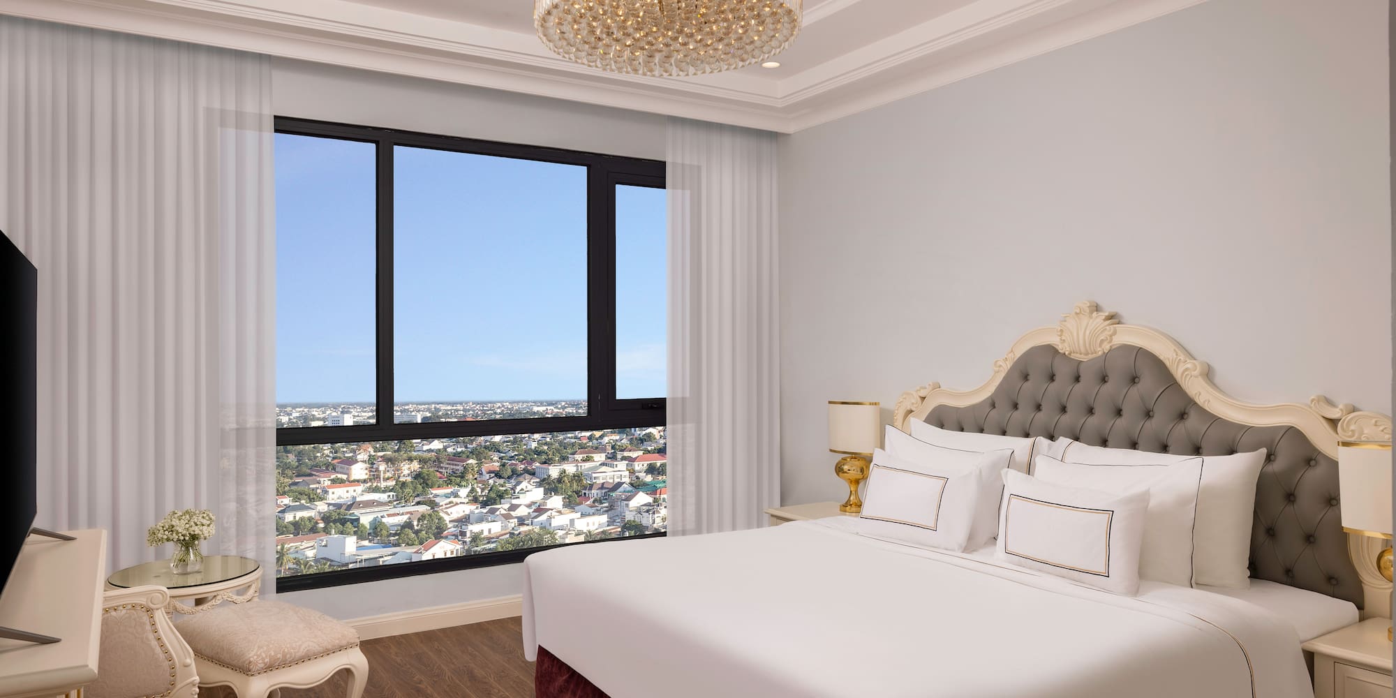 a bedroom with a large window and a large bed