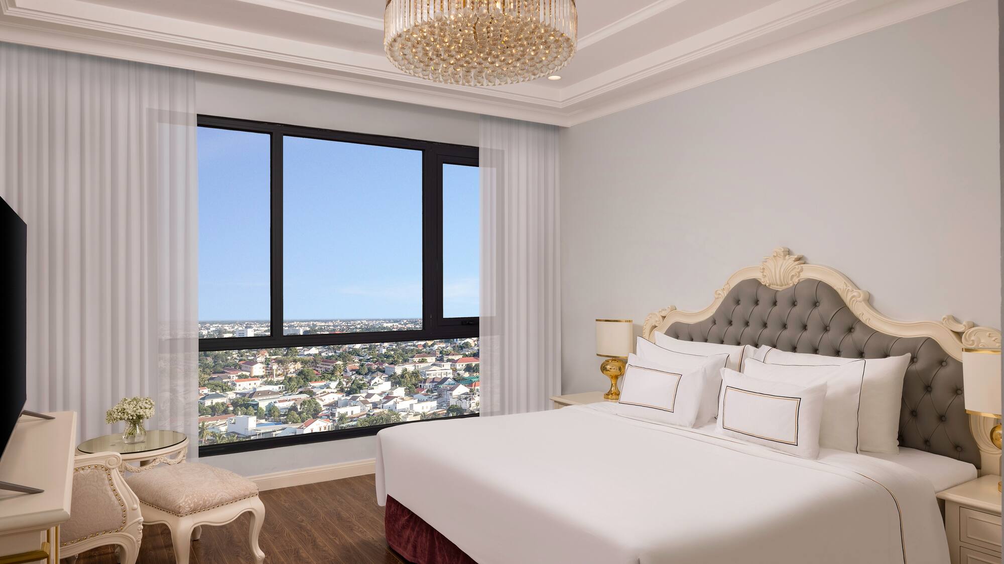 a bedroom with a large window and a large bed