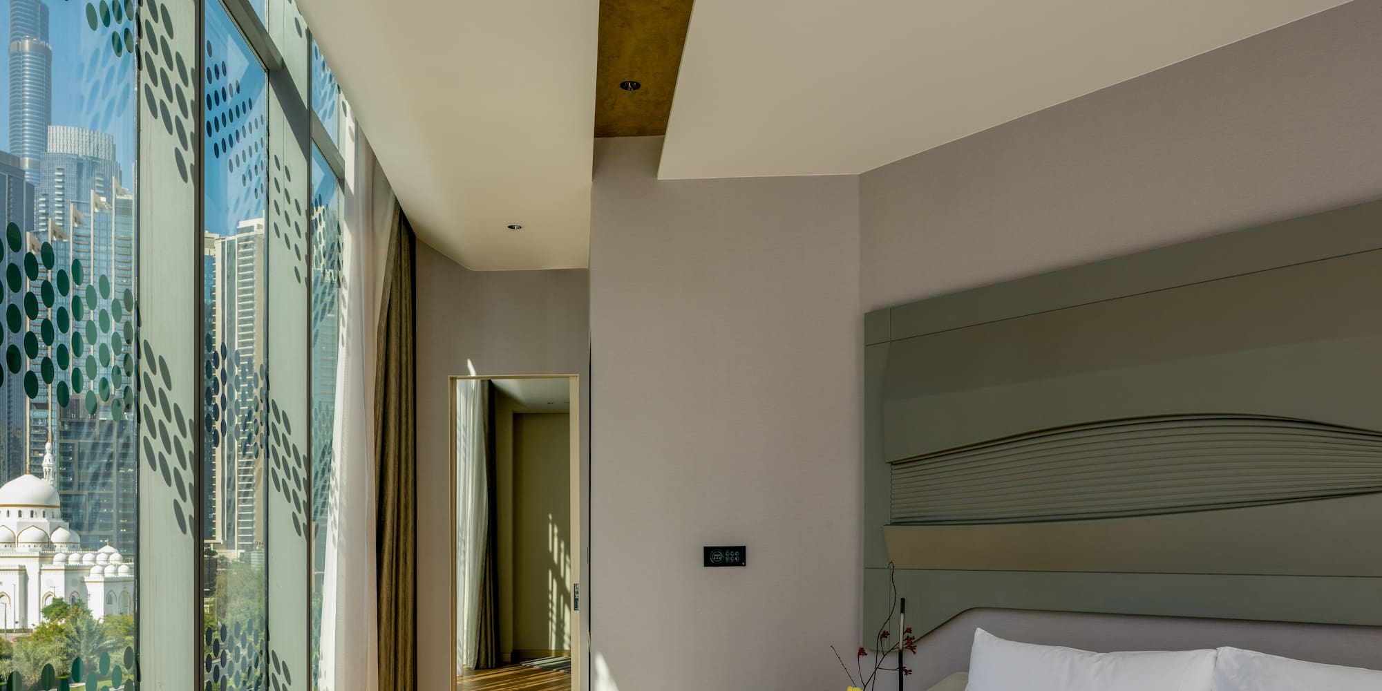 a bedroom with a large window