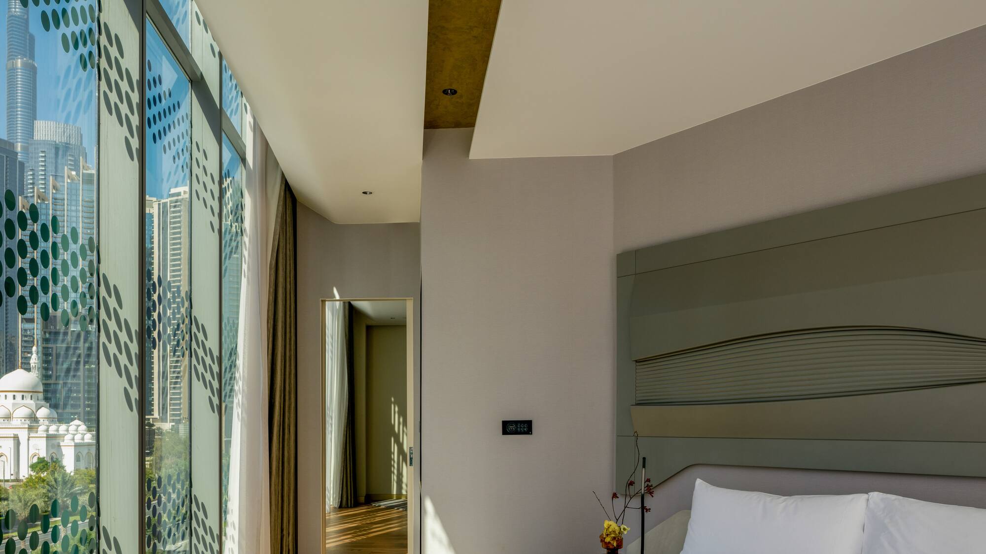 a bedroom with a large window