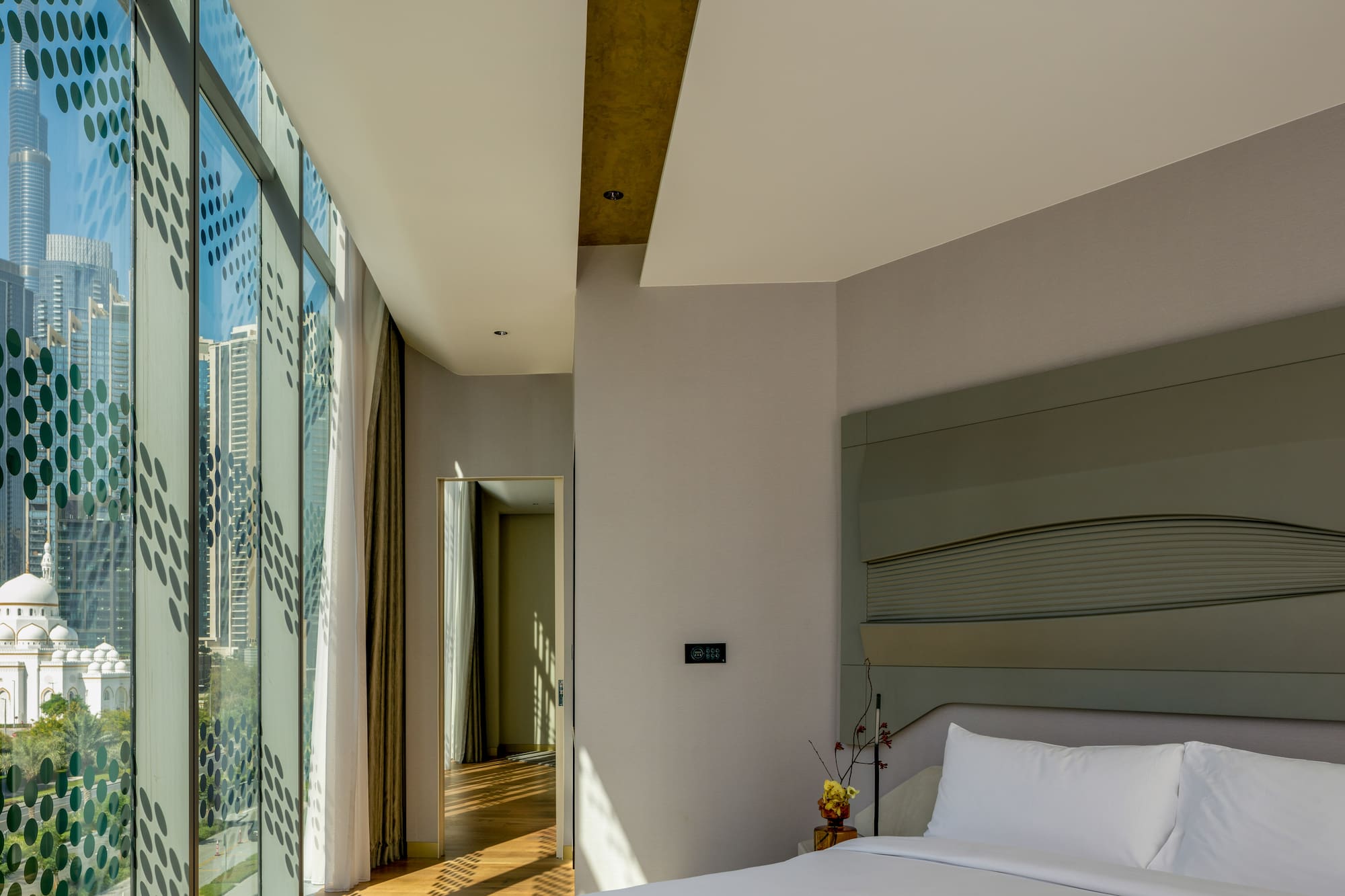 a bedroom with a large window