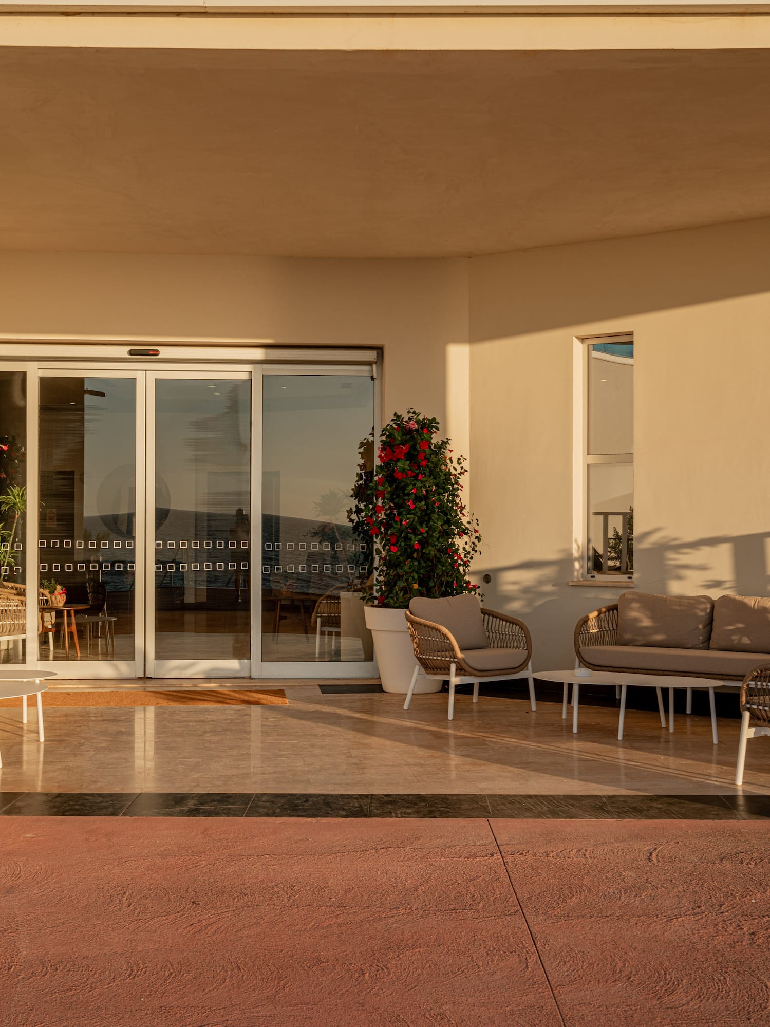 a patio with chairs and a couch