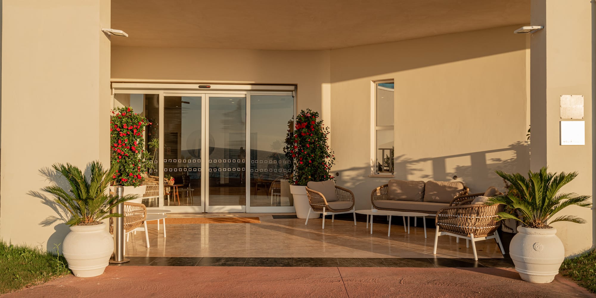 a patio with chairs and a couch