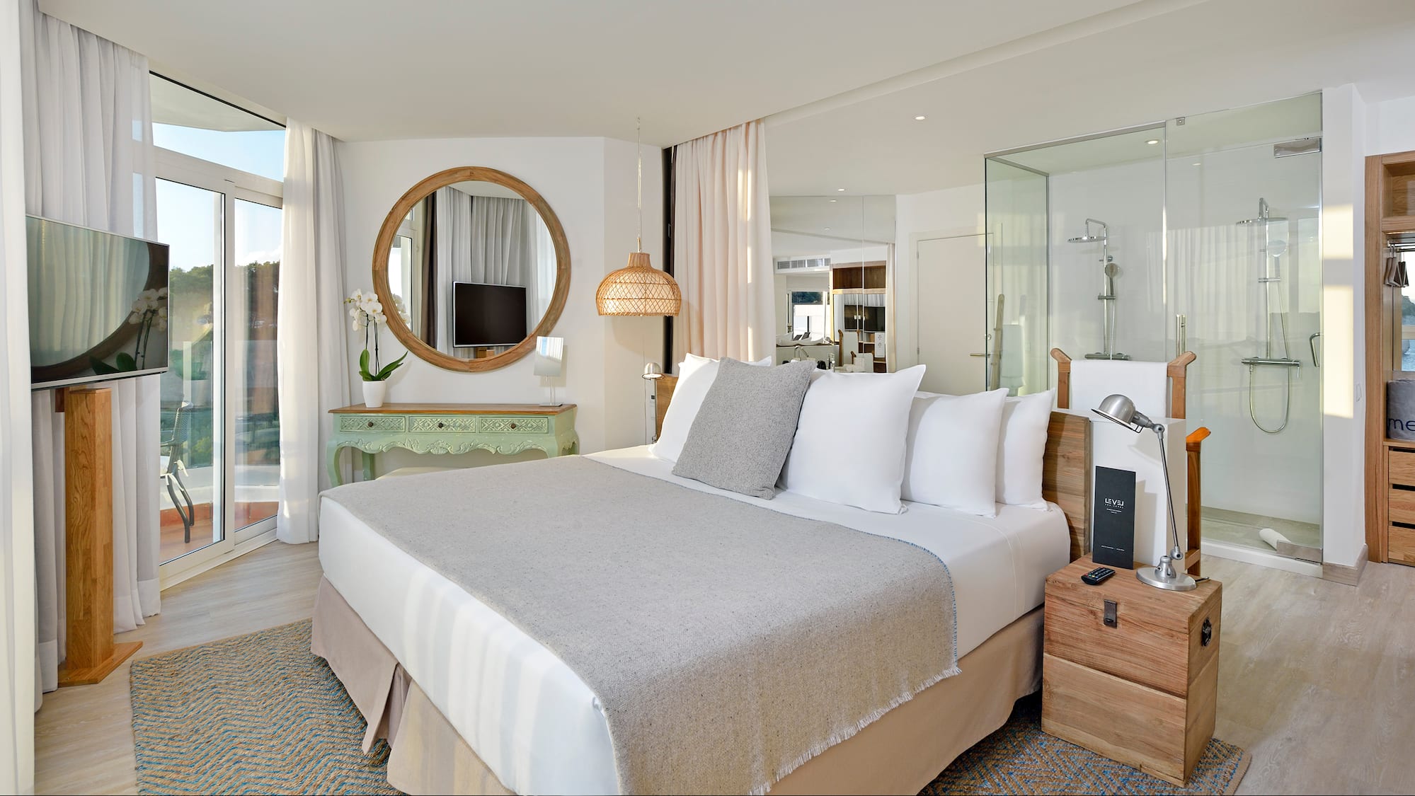 a bedroom with a bed and a mirror