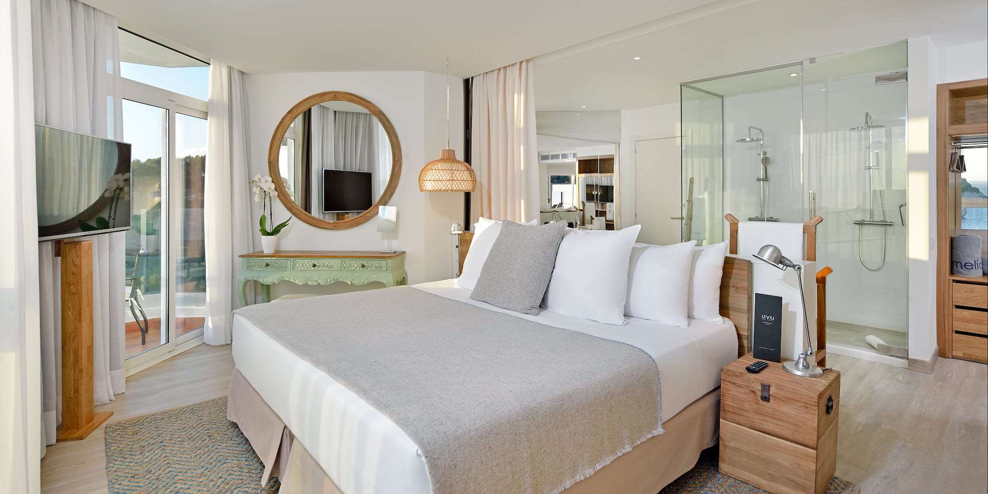 a bedroom with a bed and a mirror