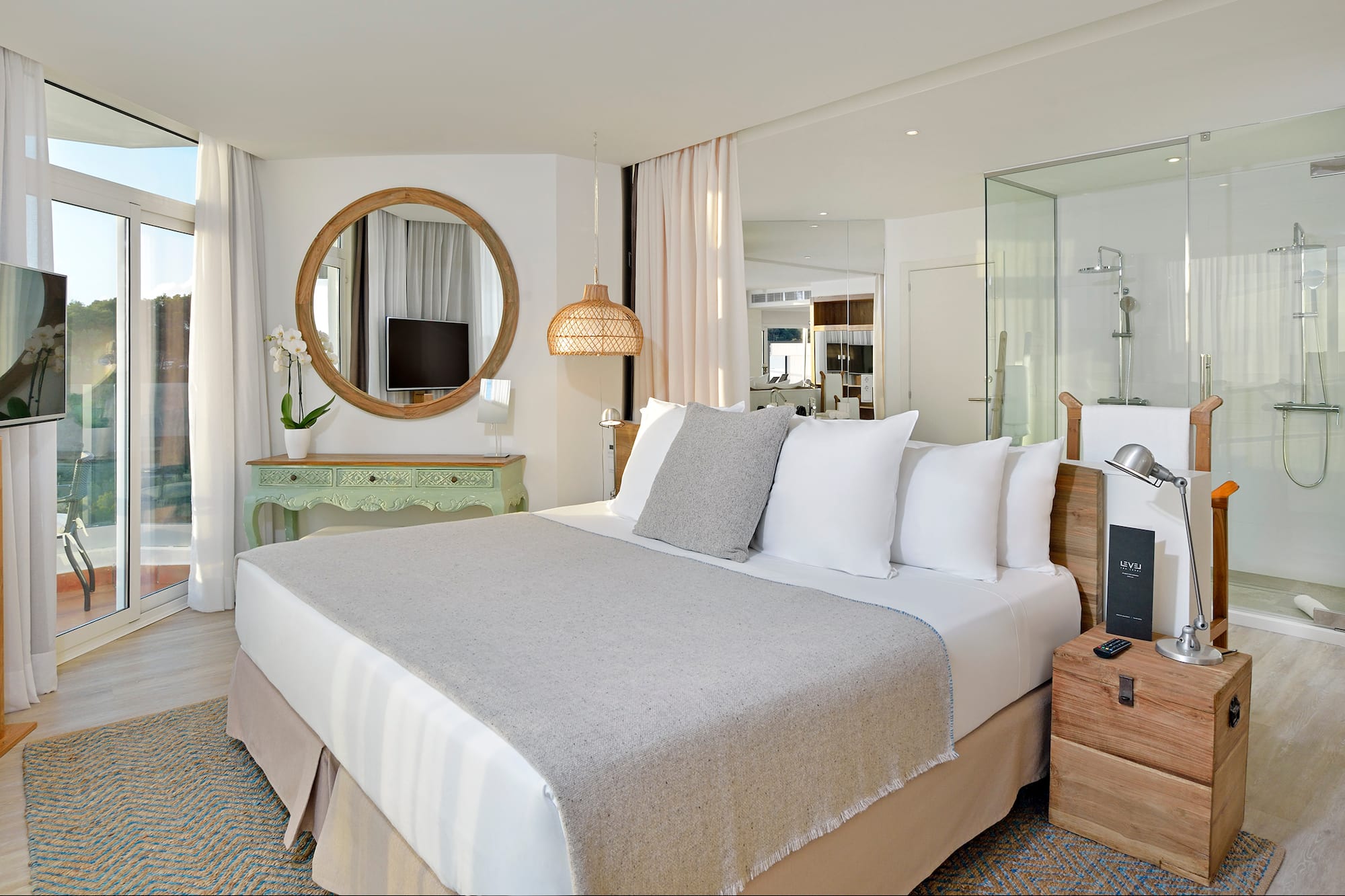 a bedroom with a bed and a mirror