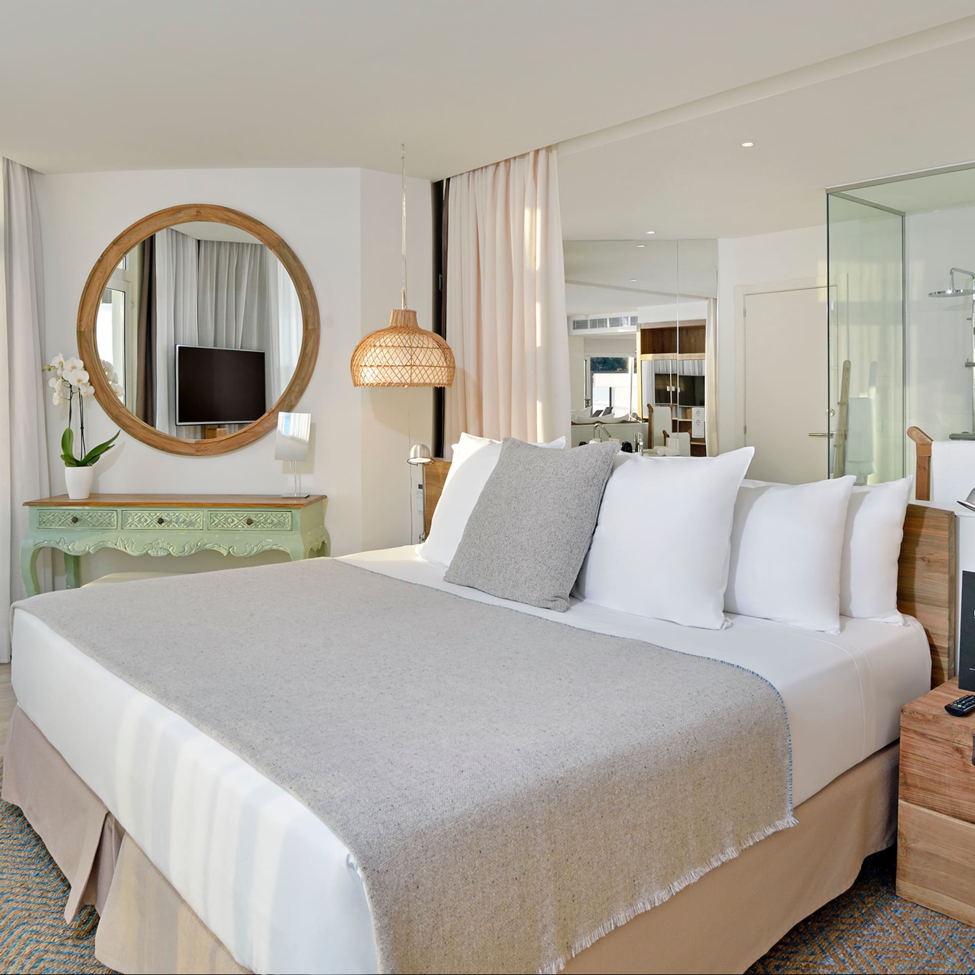 a bedroom with a bed and a mirror