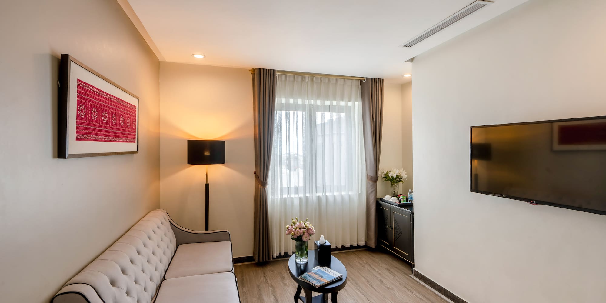 a living room with a couch and a tv