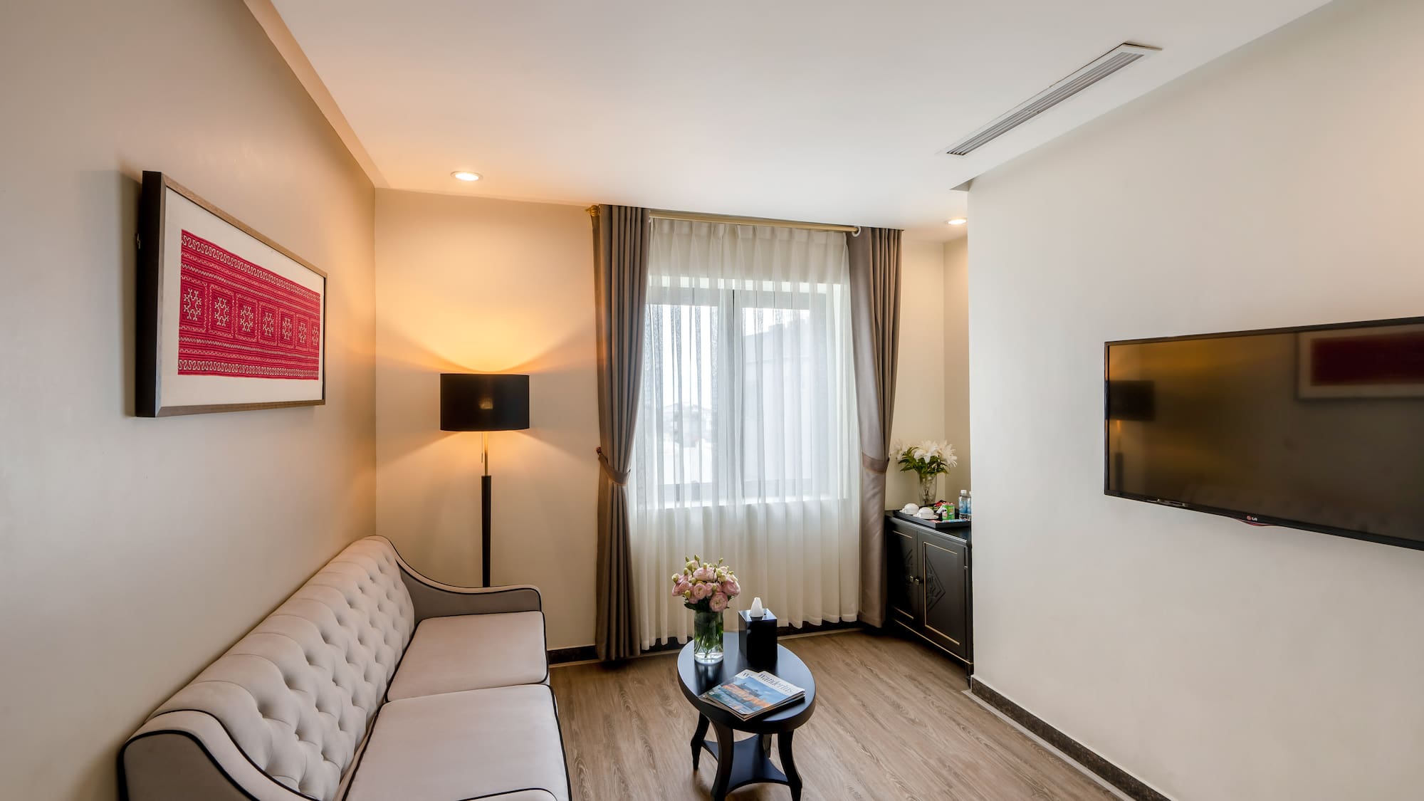 a living room with a couch and a tv