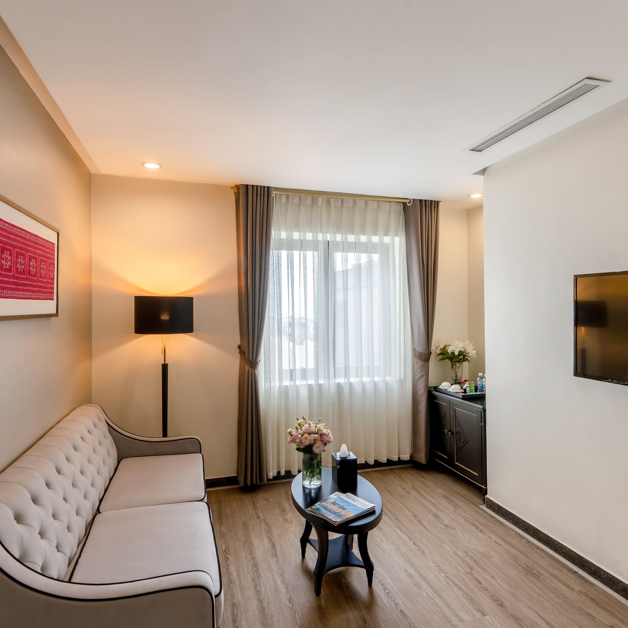 a living room with a couch and a tv