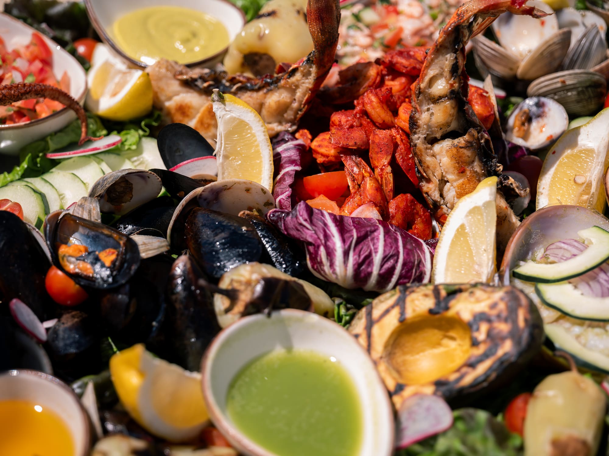 a plate of food with seafood and sauce
