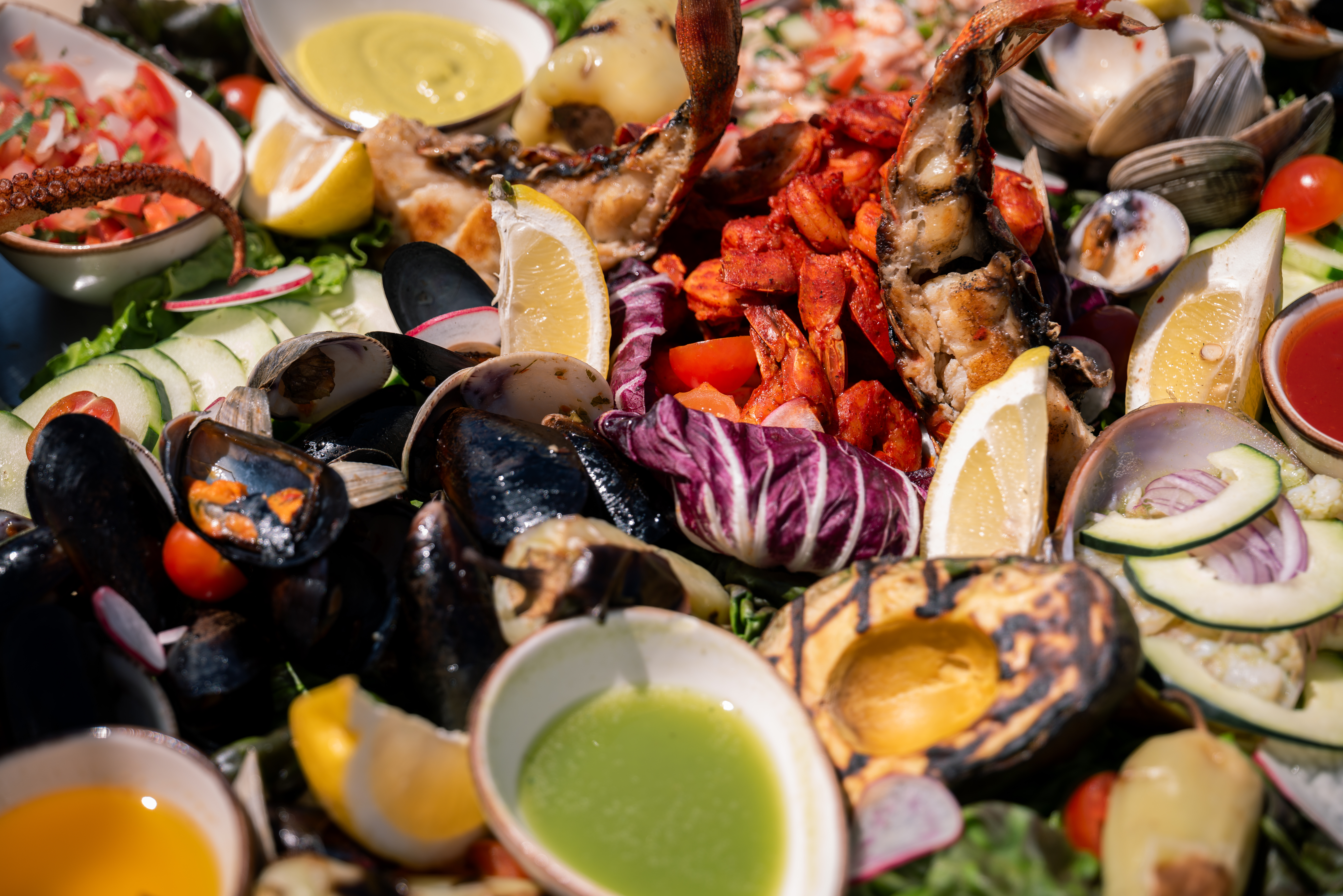 a plate of food with seafood and sauce