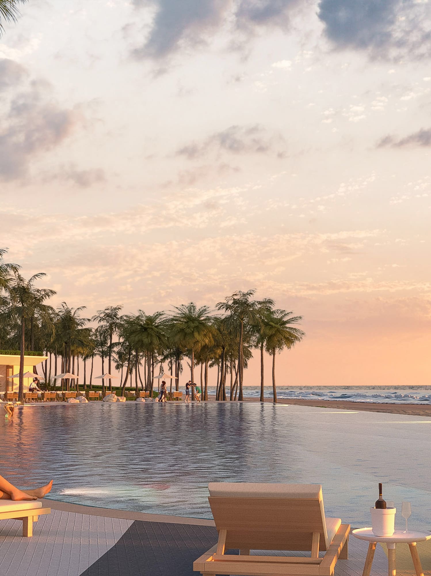 a woman sitting on a lounge chair next to a pool