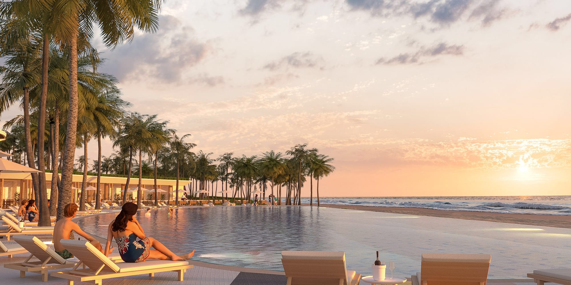 a woman sitting on a lounge chair next to a pool