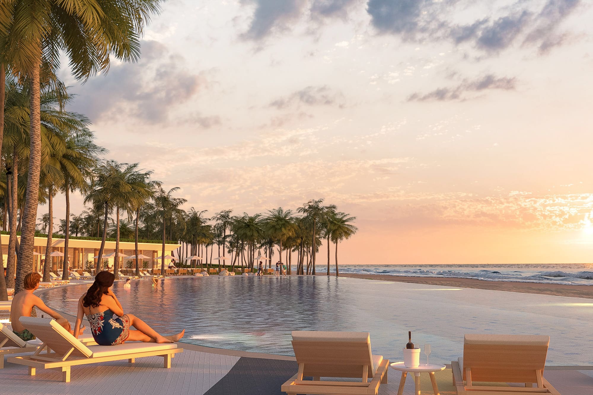 a woman sitting on a lounge chair next to a pool