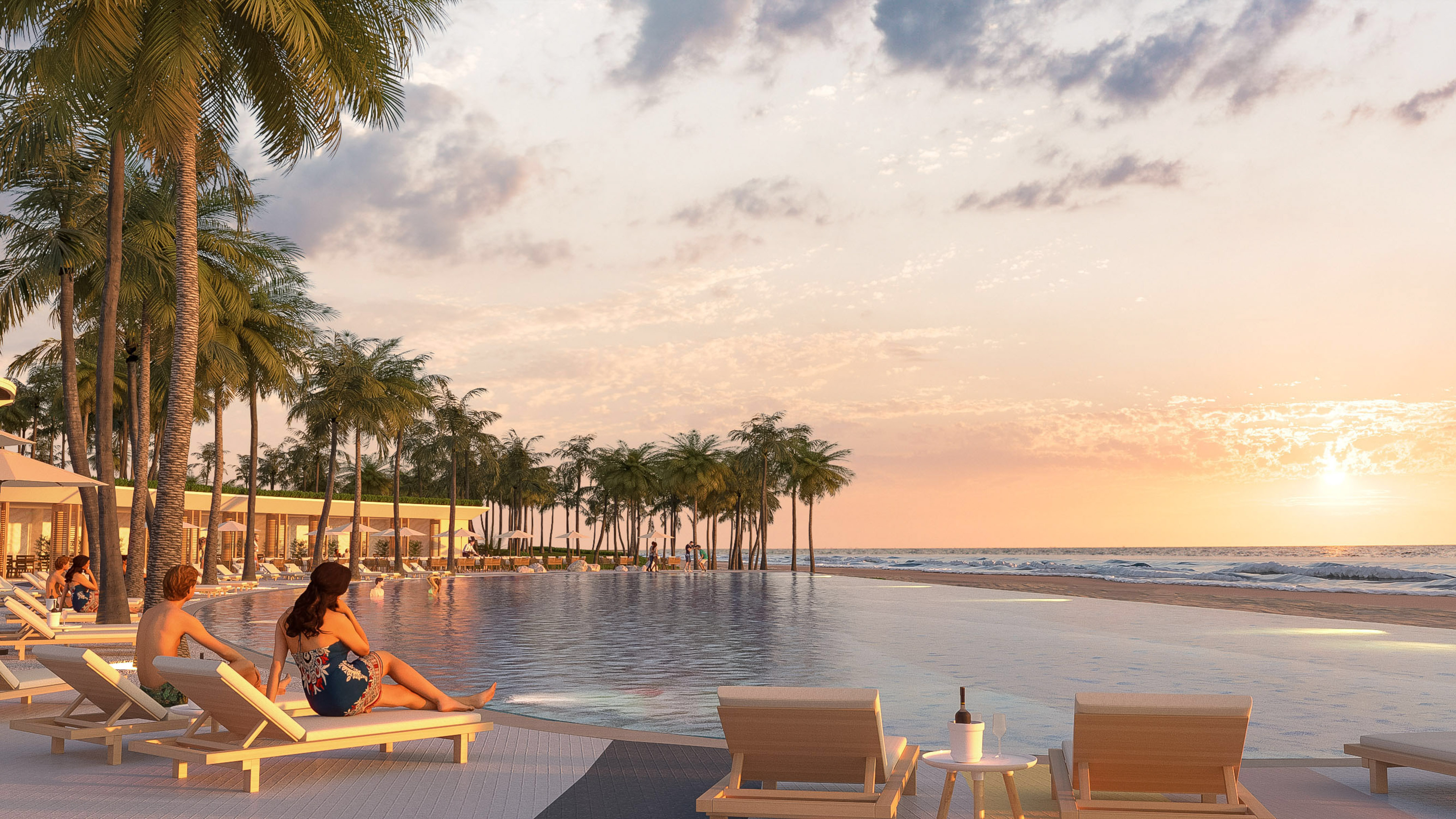 Luxury resort with infinity pool overlooking ocean and palm trees at sunset.