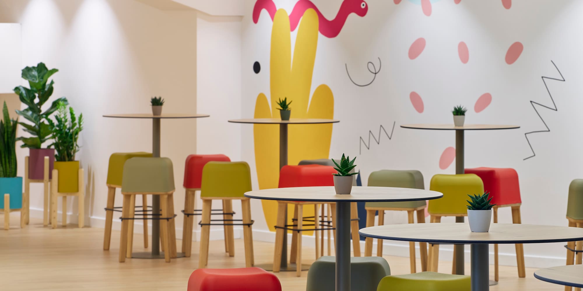 a room with tables and chairs