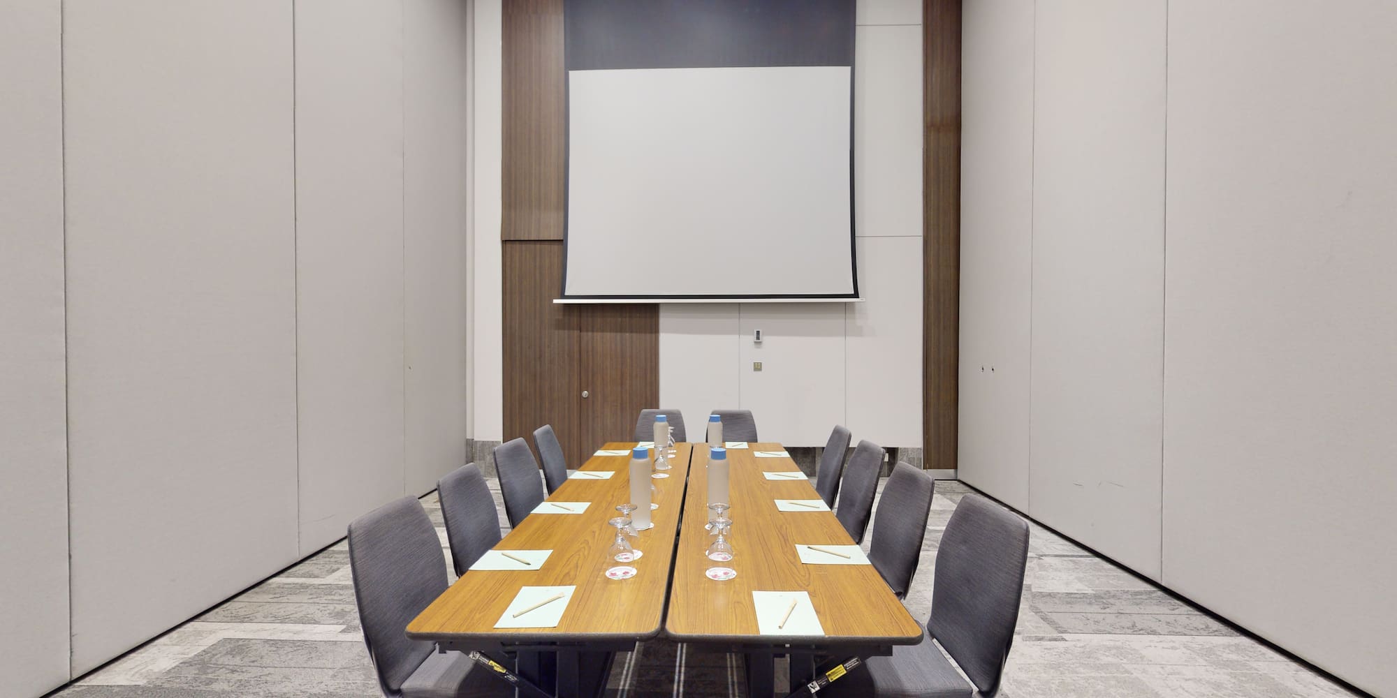 a conference room with a table and chairs