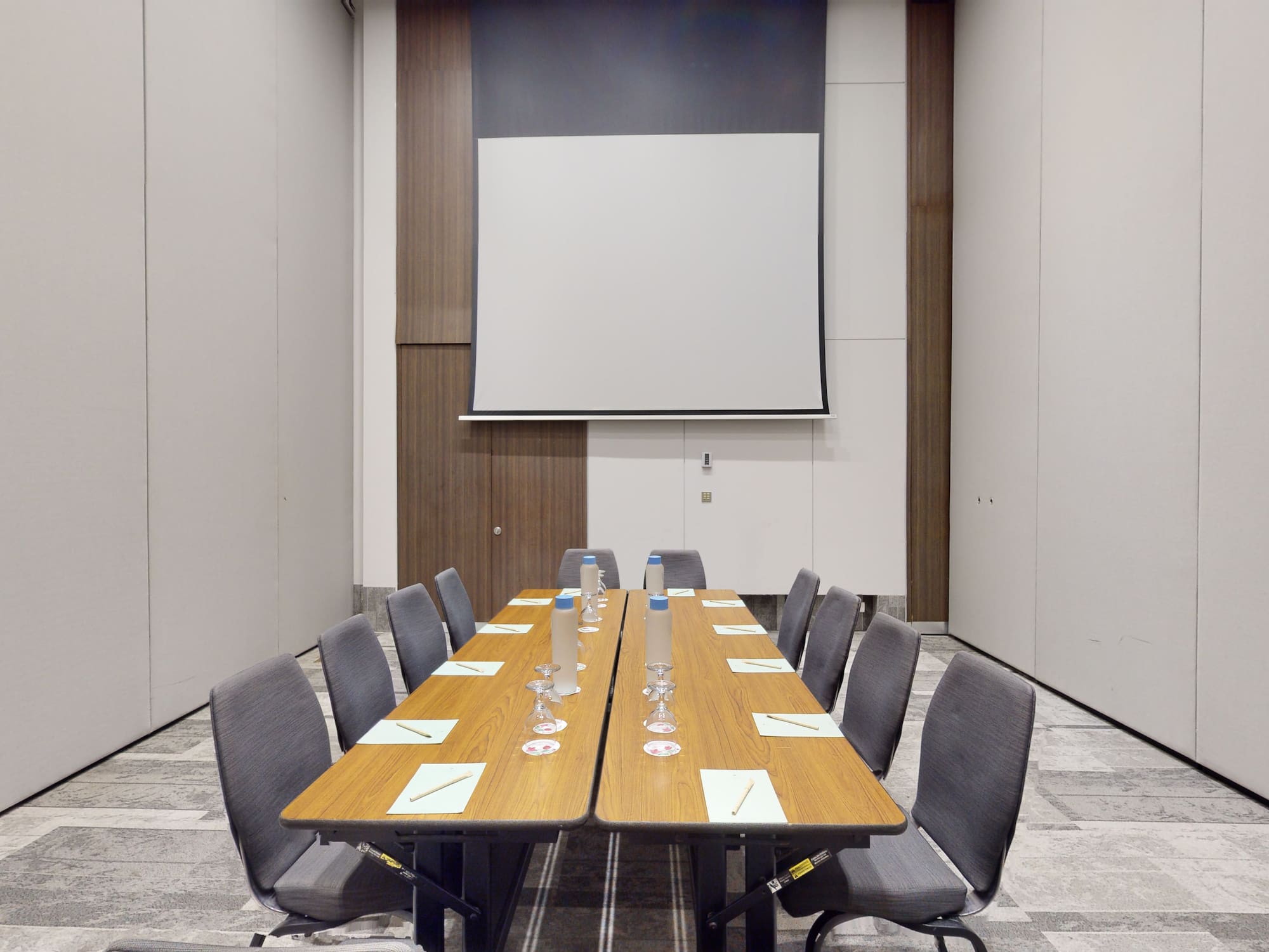 a conference room with a table and chairs