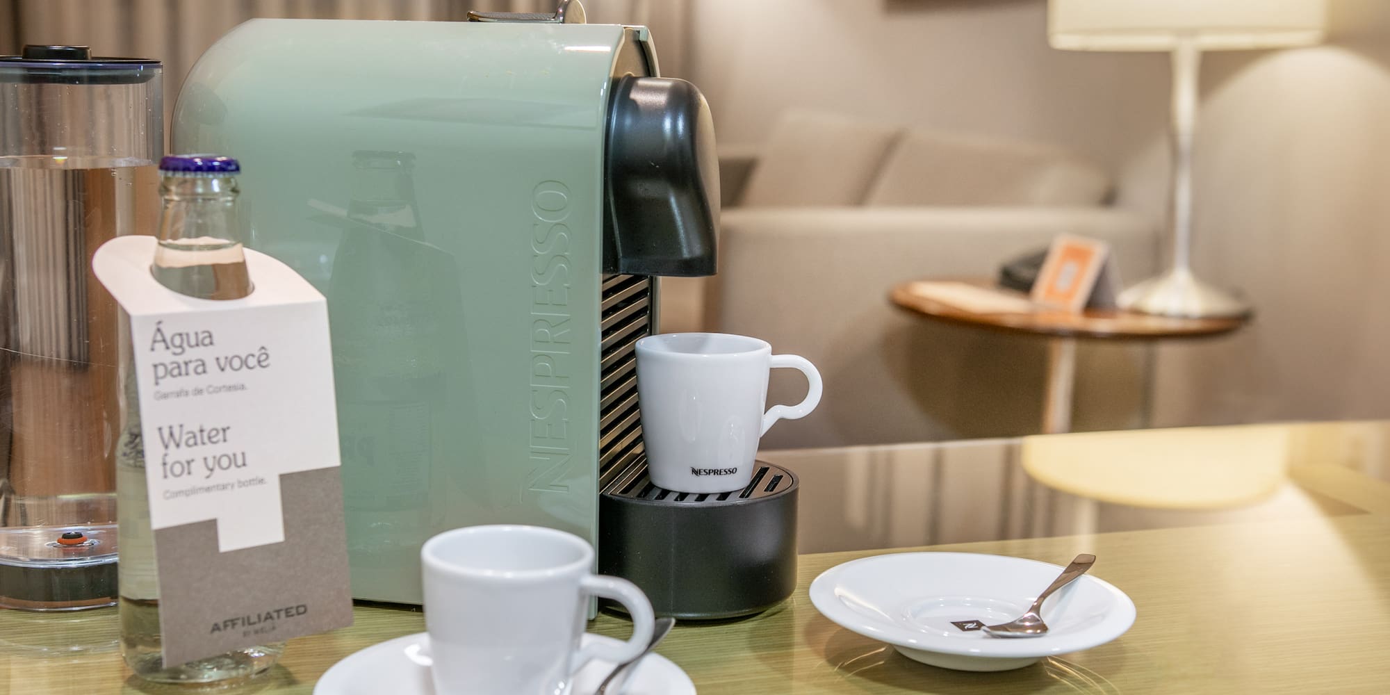 a coffee machine and cups on a table