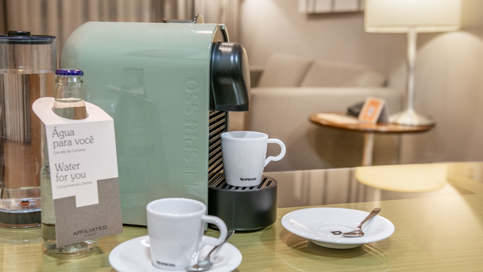 a coffee machine and cups on a table