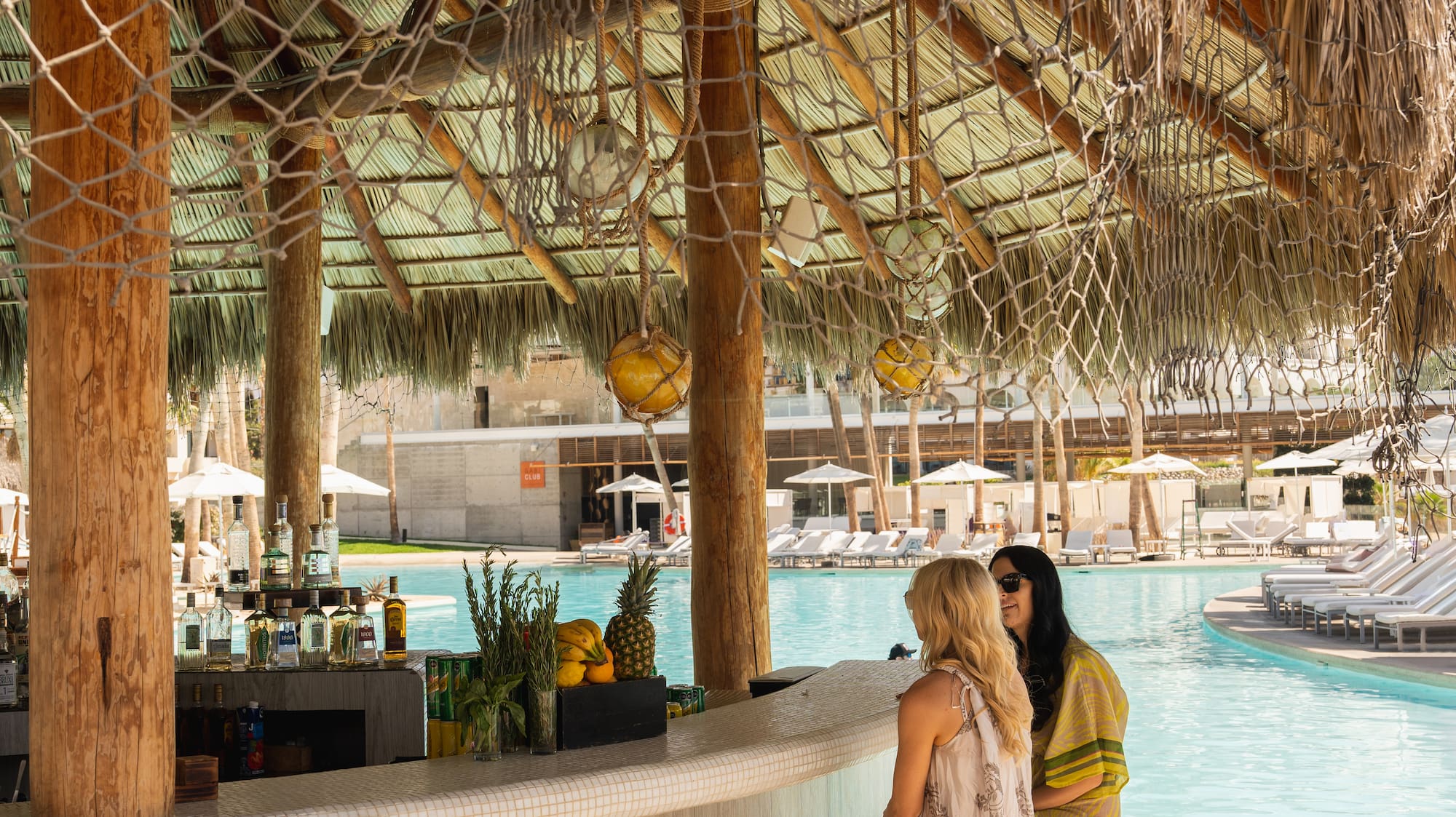 two women sitting at a bar