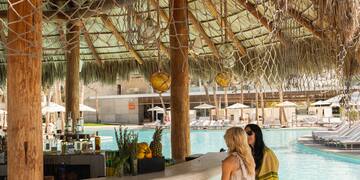 two women sitting at a bar