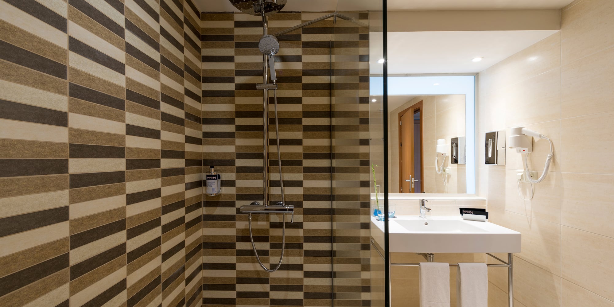 a bathroom with a shower and sink