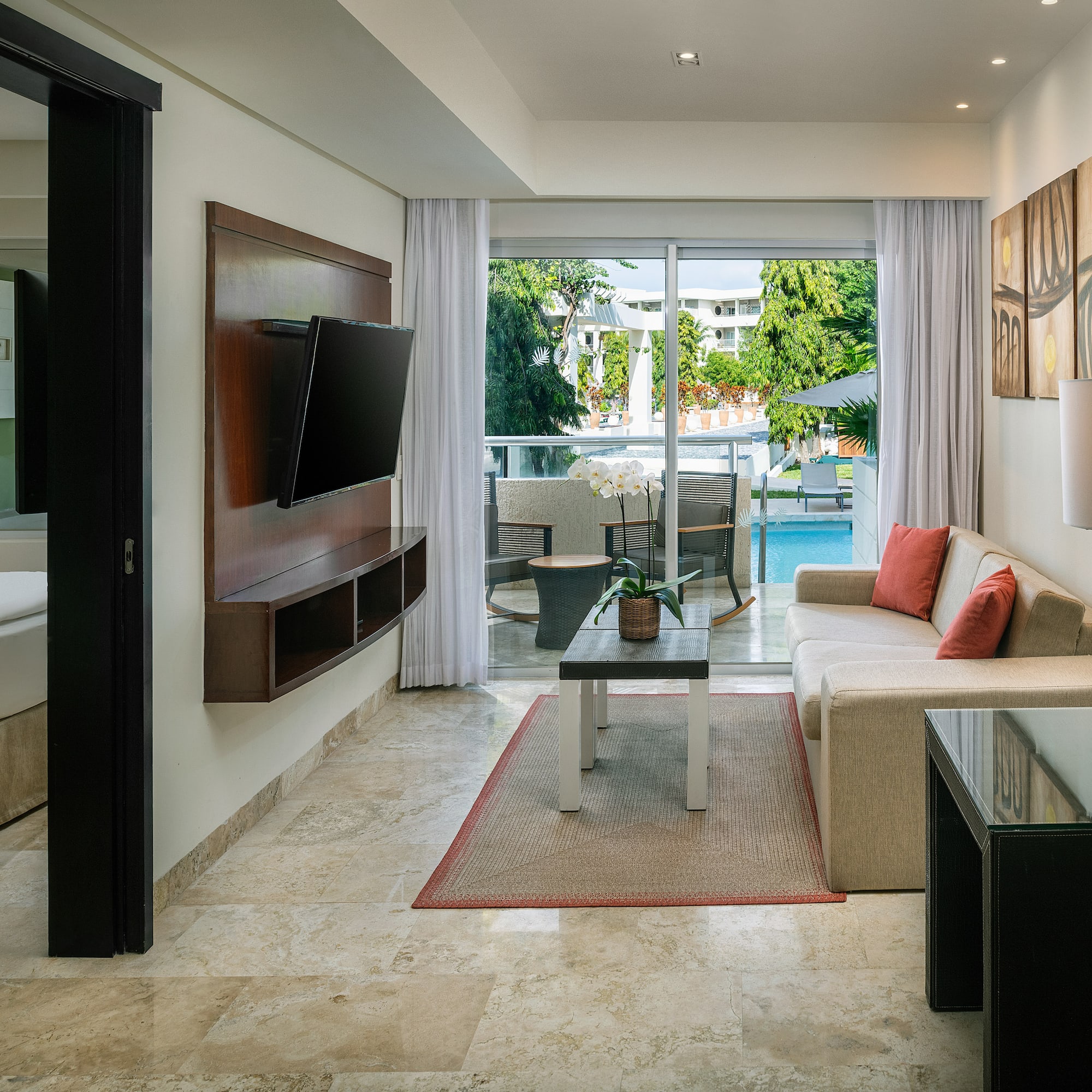 a living room with a television and a couch