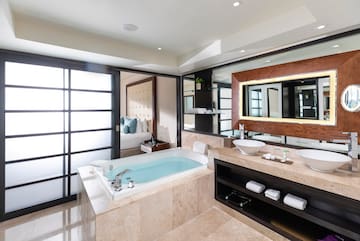 a bathroom with a tub and sink