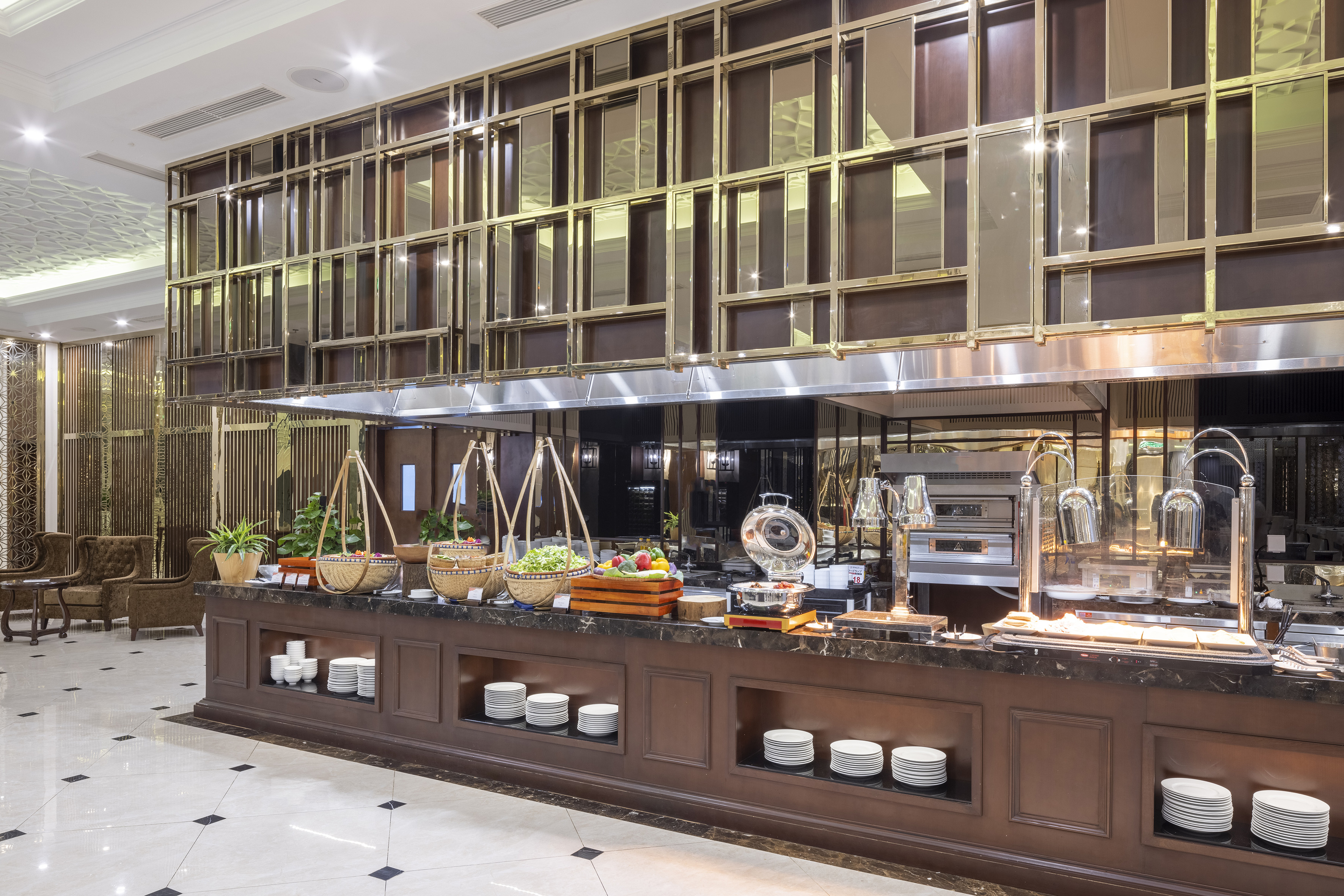 Elegant hotel buffet with fresh salads, hot food stations, and luxury decor.