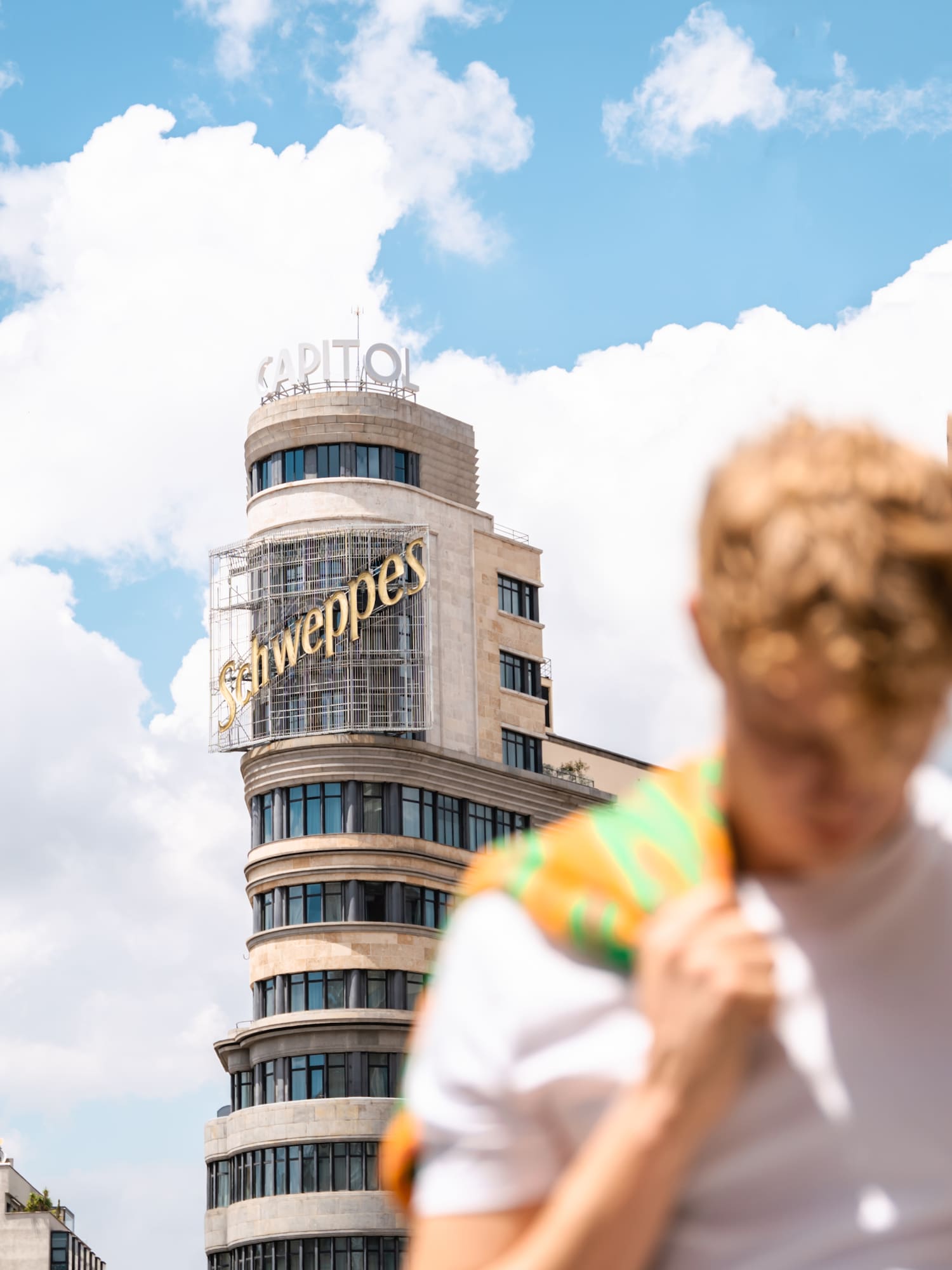 a man in front of a building
