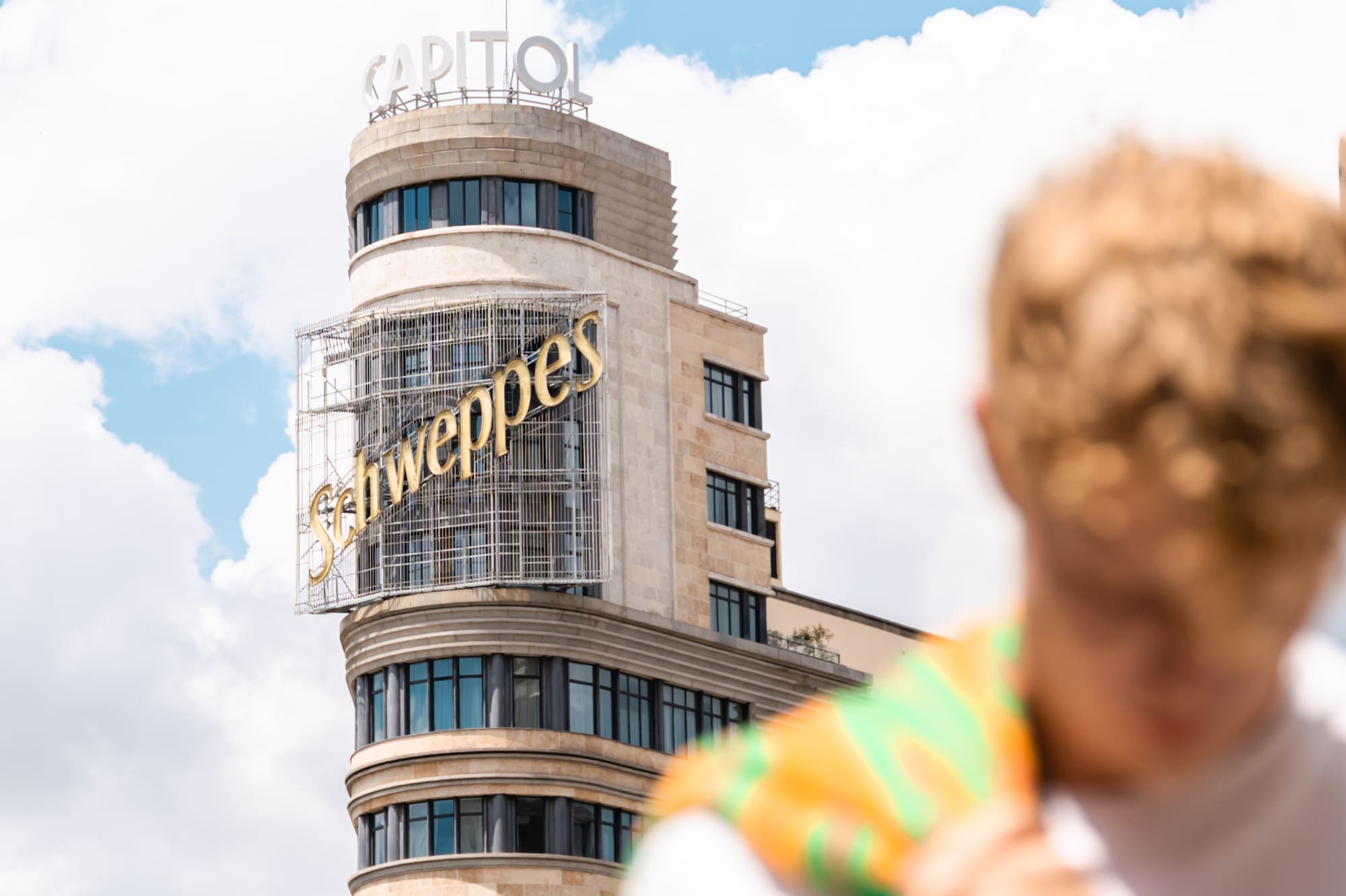 a man in front of a building