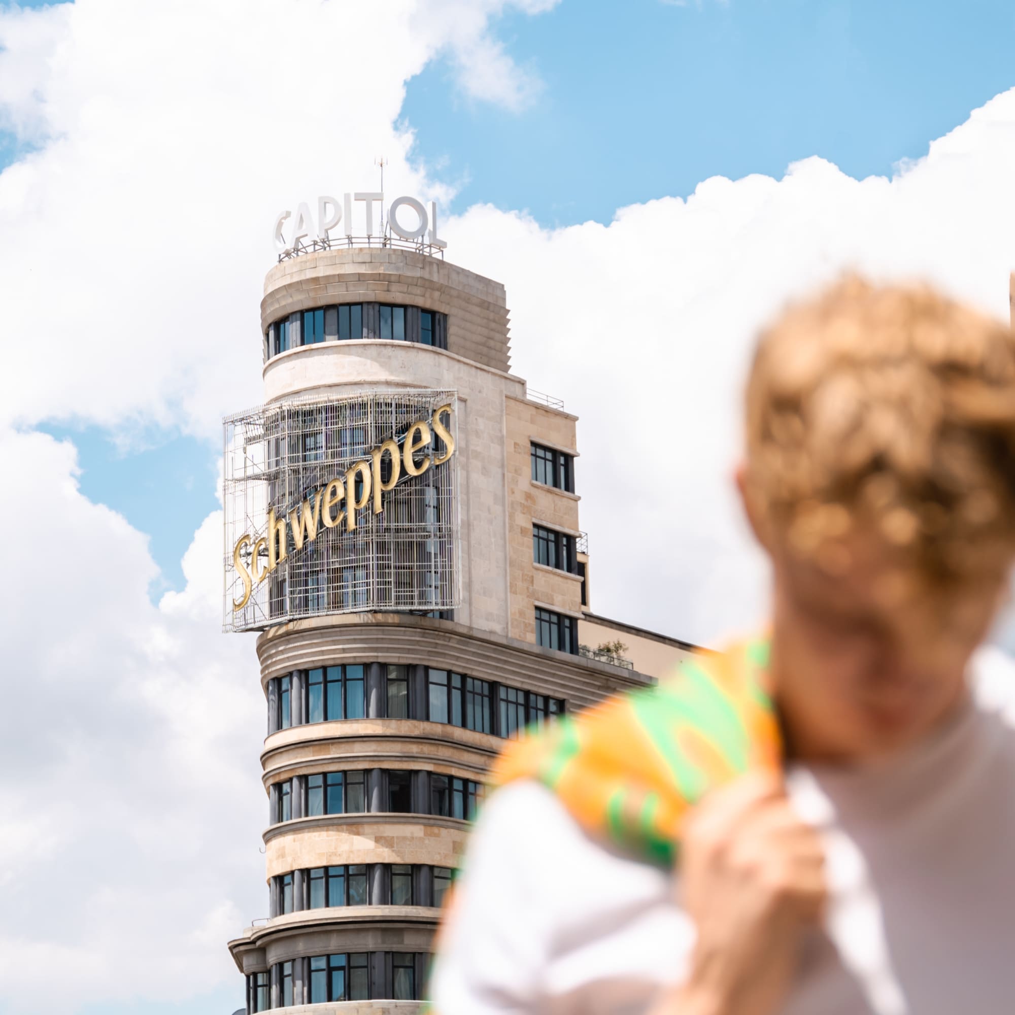 a man in front of a building