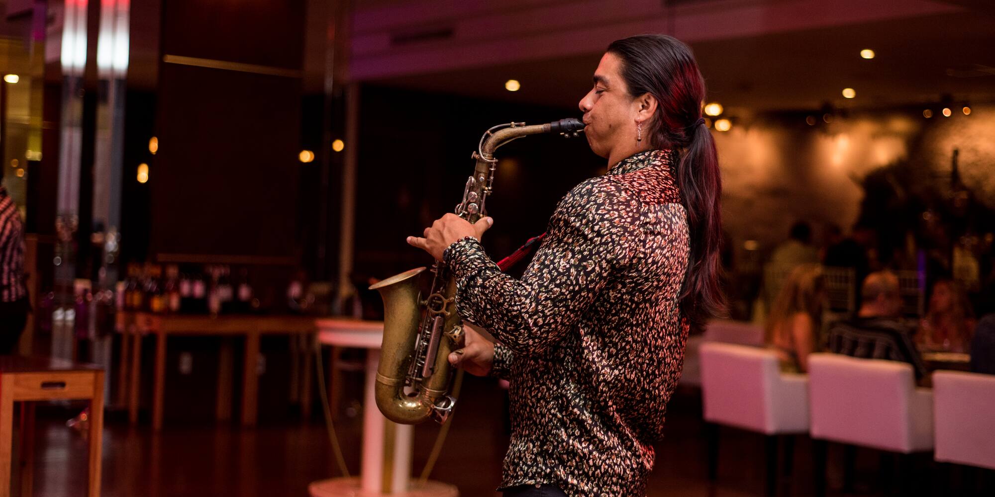 a man playing a saxophone