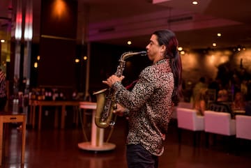 a man playing a saxophone