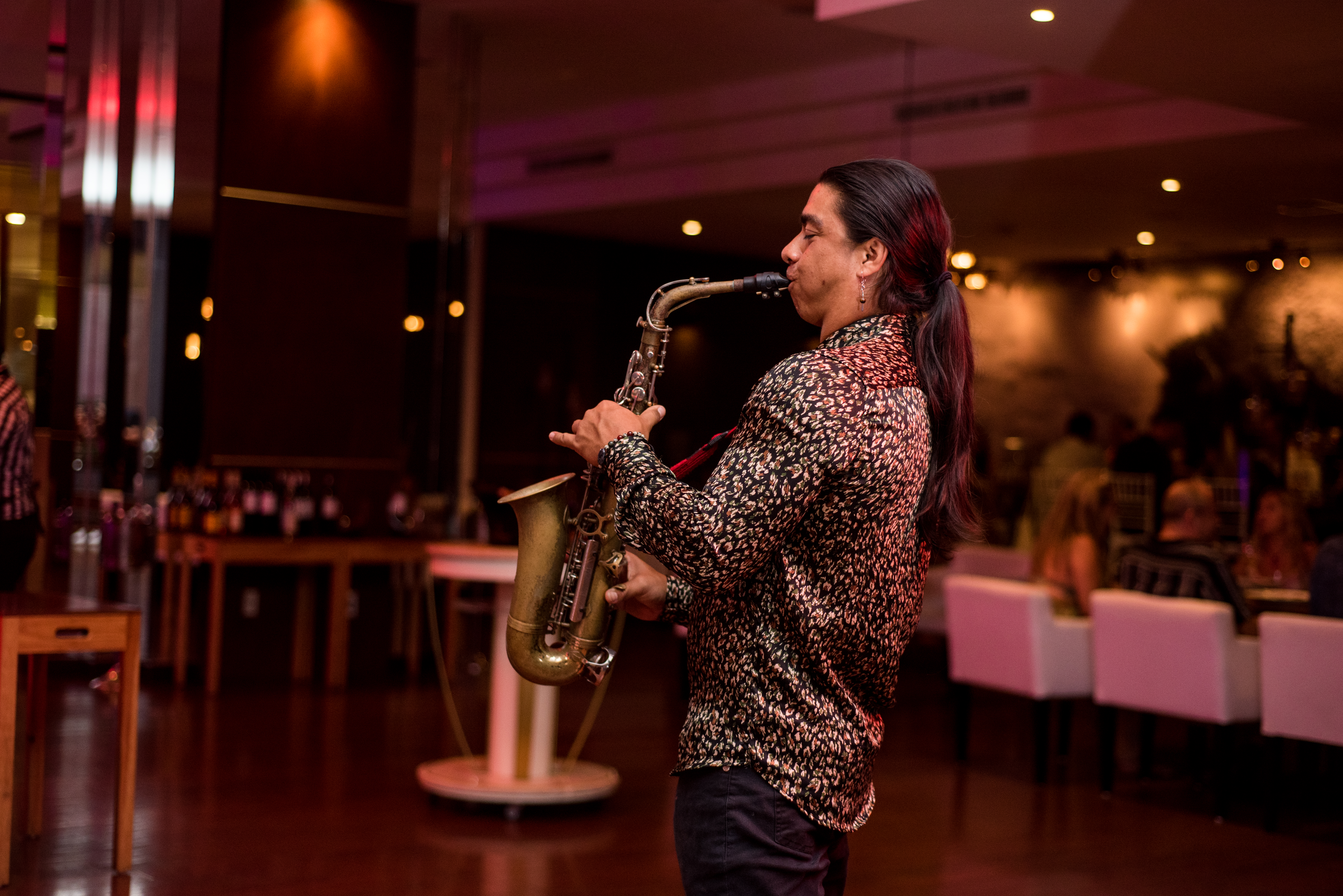 a man playing a saxophone